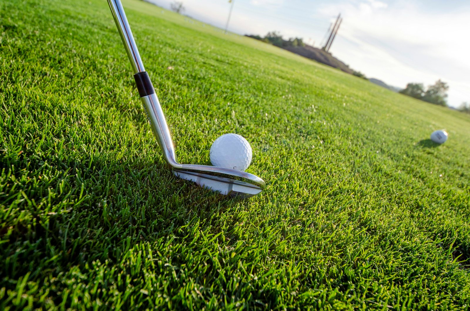 Golfer putting on green